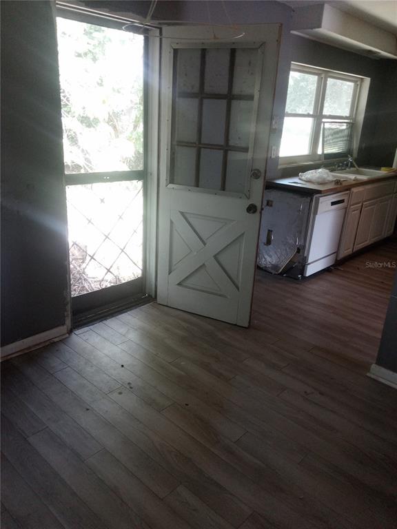 2822 South Dean Road Orlando, FL 32825 - Photo 23 of 43 an empty room with wooden floor and windows