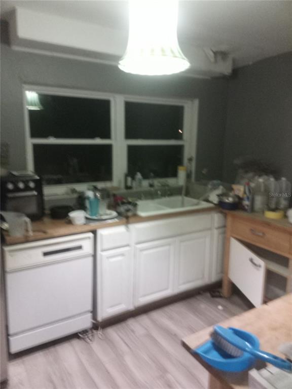 2822 South Dean Road Orlando, FL 32825 - Photo 24 of 43 a kitchen with a sink and cabinets