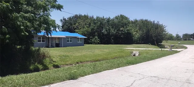 a view of a house with a yard