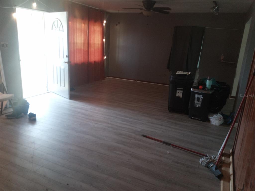 2822 South Dean Road Orlando, FL 32825 - Photo 42 of 43 a view of a hallway with wooden floor