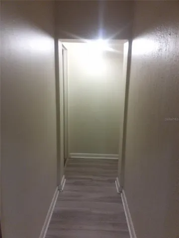 a view of hallway with shower