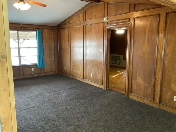 a kitchen with wooden cabinets and a sink