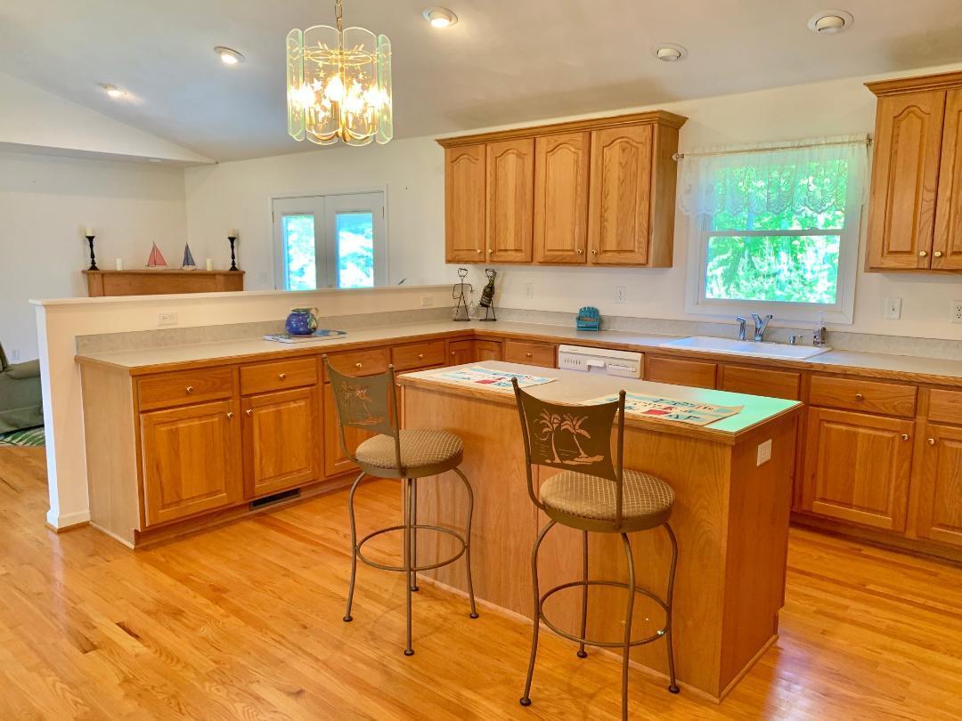 525 Mallard Point Road Wirtz, VA 24184 - Photo 12 of 38 a kitchen with a sink cabinets and window