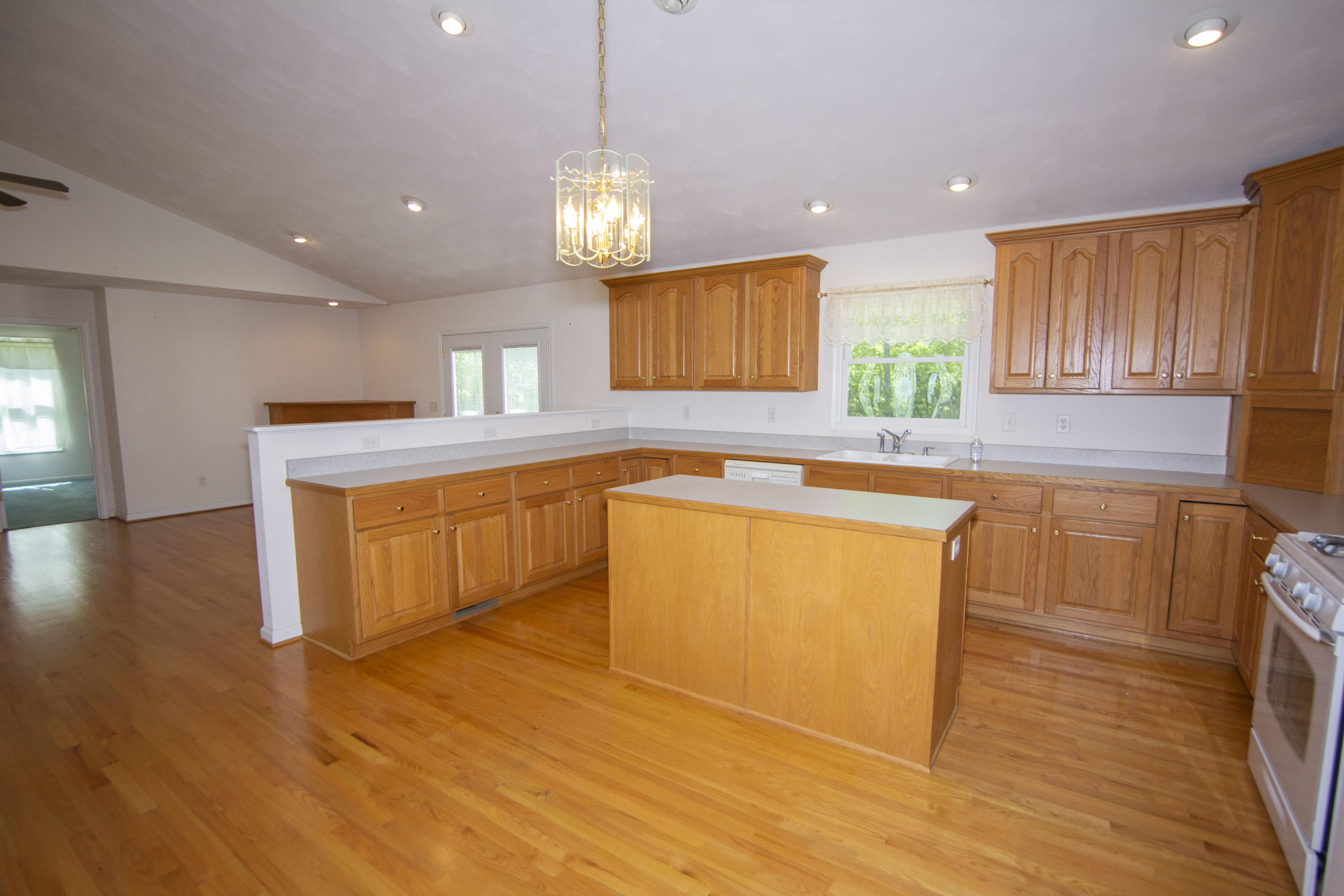 525 Mallard Point Road Wirtz, VA 24184 - Photo 13 of 38 a kitchen with stainless steel appliances granite countertop a sink a stove and a wooden floors