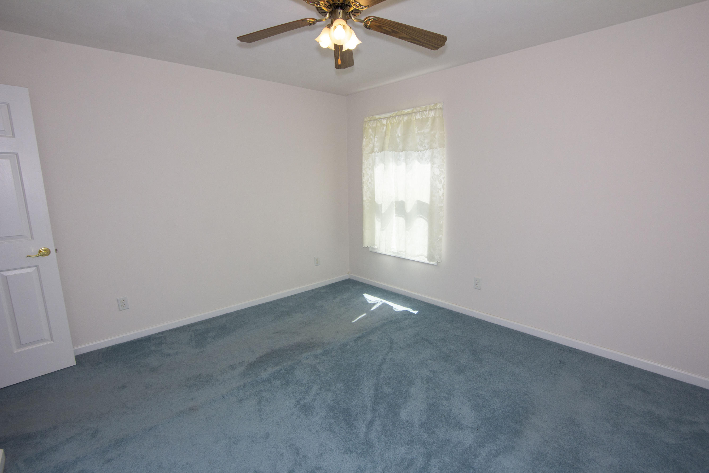 525 Mallard Point Road Wirtz, VA 24184 - Photo 24 of 38 an empty room with chandelier fan and windows