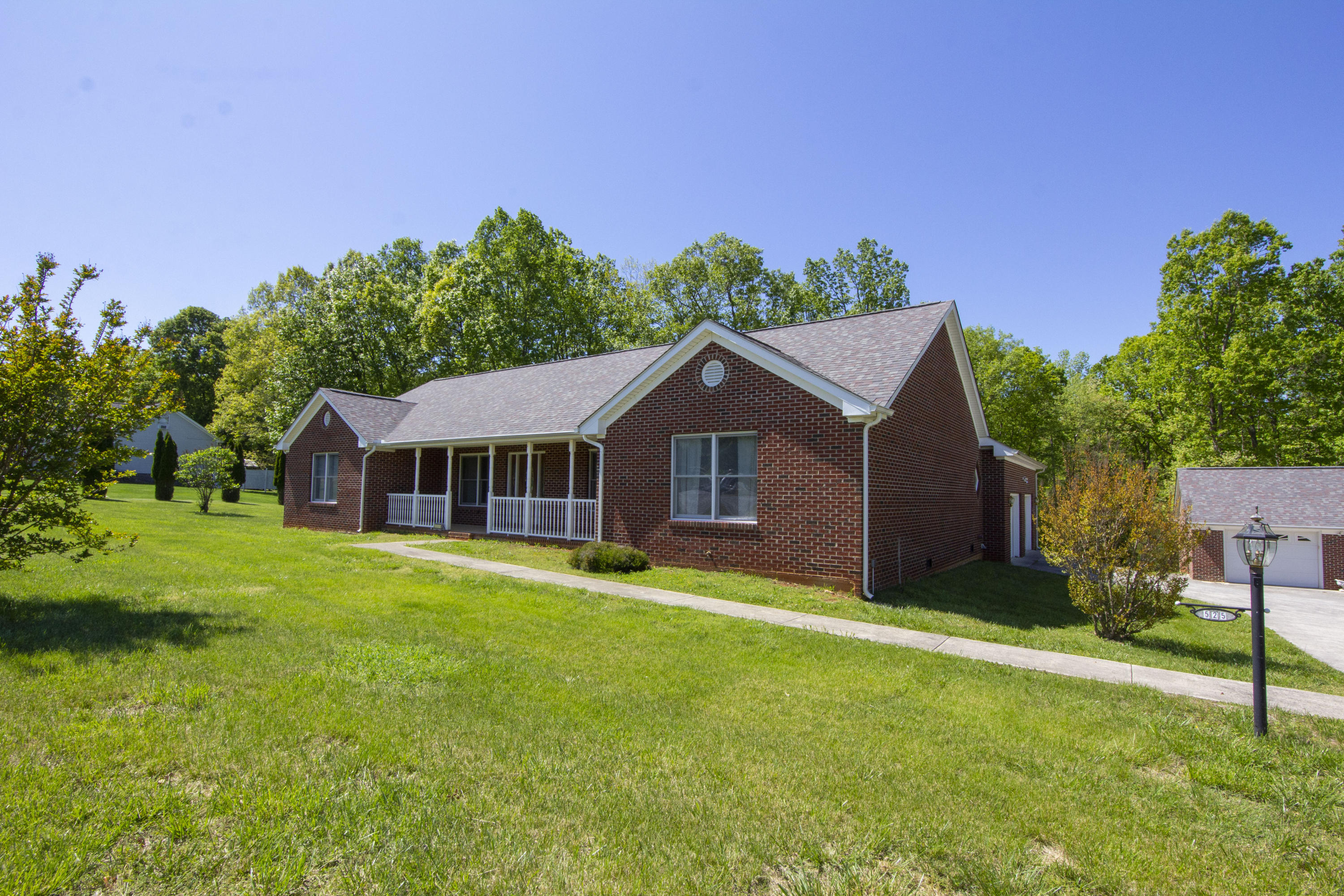 525 Mallard Point Road Wirtz, VA 24184 - Photo 33 of 38 a front view of a house with a yard and trees