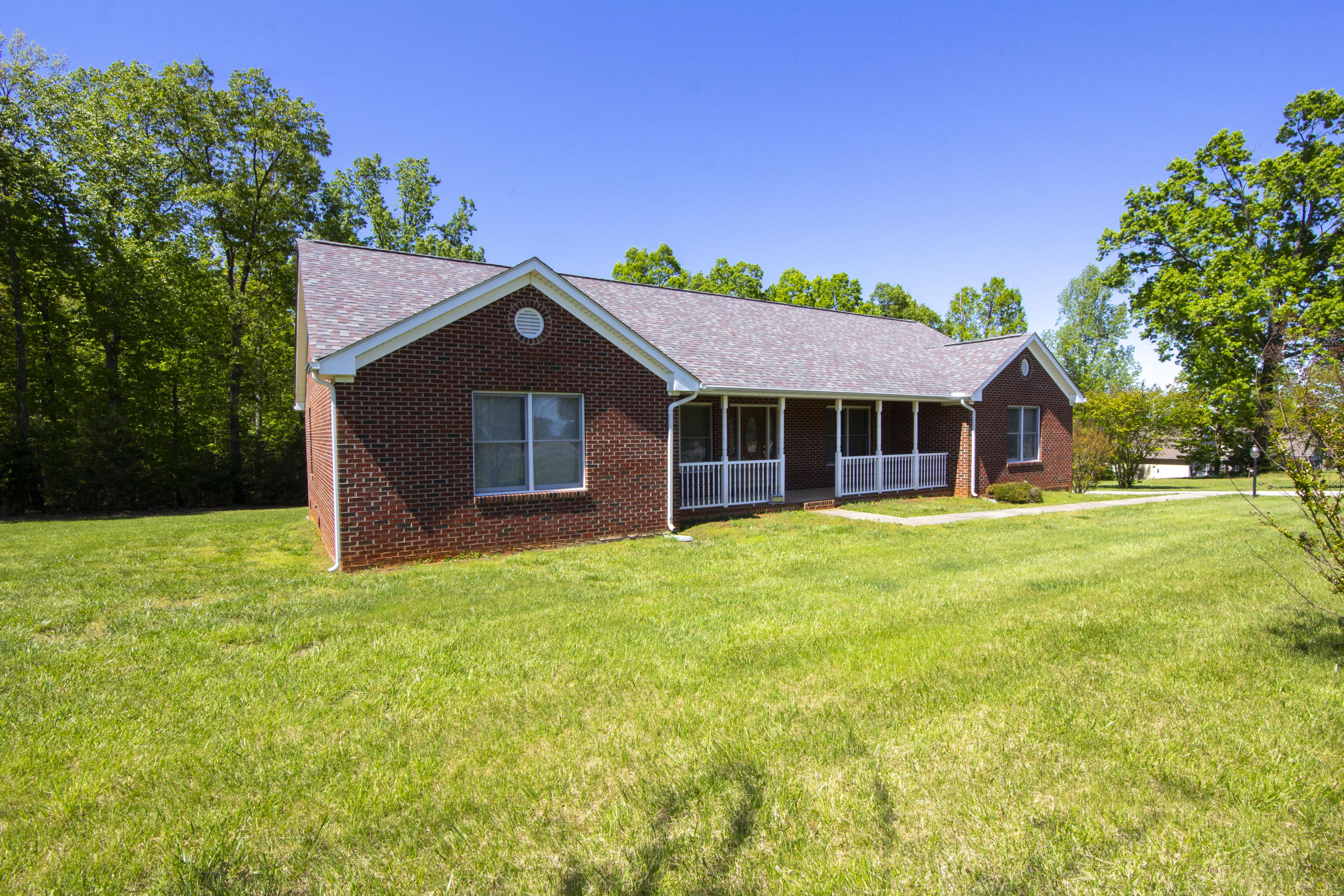 525 Mallard Point Road Wirtz, VA 24184 - Photo 35 of 38 a front view of a house with a garden