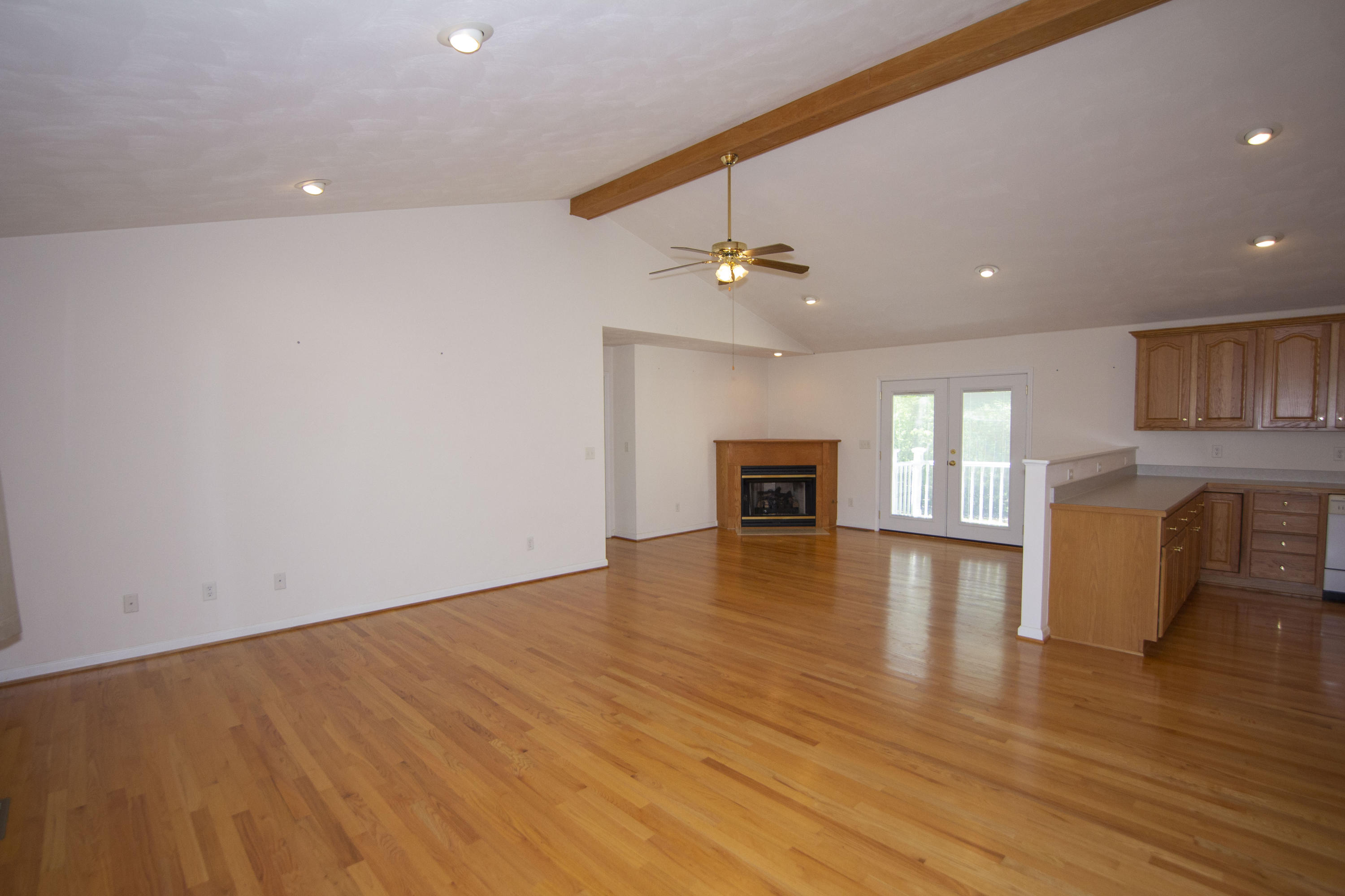 525 Mallard Point Road Wirtz, VA 24184 - Photo 6 of 38 a view of empty room with wooden floor and fireplace