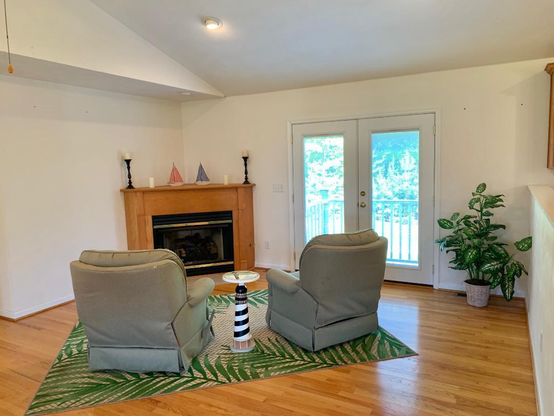 525 Mallard Point Road Wirtz, VA 24184 - Photo 7 of 38 a living room with furniture and a fireplace