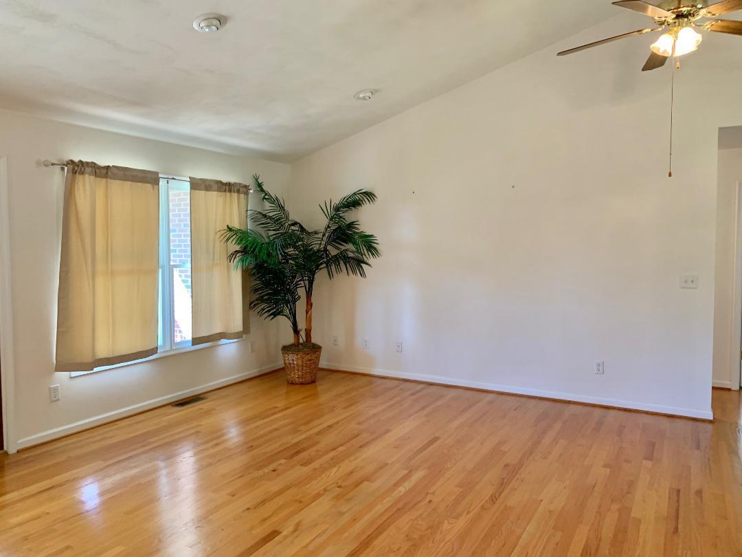 525 Mallard Point Road Wirtz, VA 24184 - Photo 8 of 38 a view of an empty room with a window and wooden floor