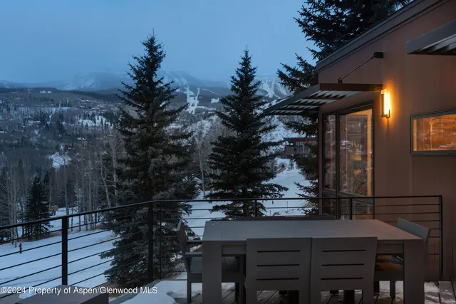 a view of a terrace with couches and sky view