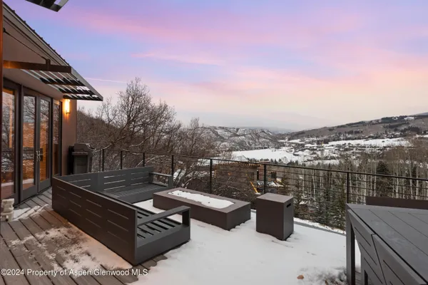 a view of backyard with sitting area
