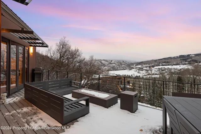 a view of backyard with sitting area