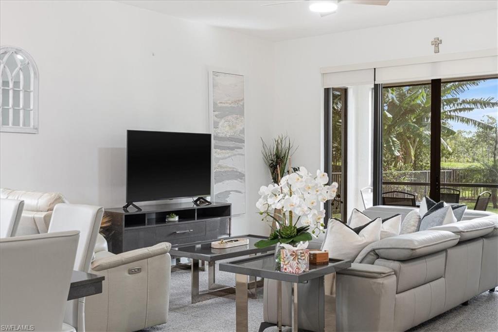 4925 Gambero Way Avenue Immokalee, FL 34142 - Photo 12 of 50 a living room with furniture and a flat screen tv