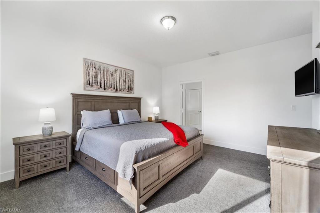 4925 Gambero Way Avenue Immokalee, FL 34142 - Photo 20 of 50 a bedroom with a bed and a television