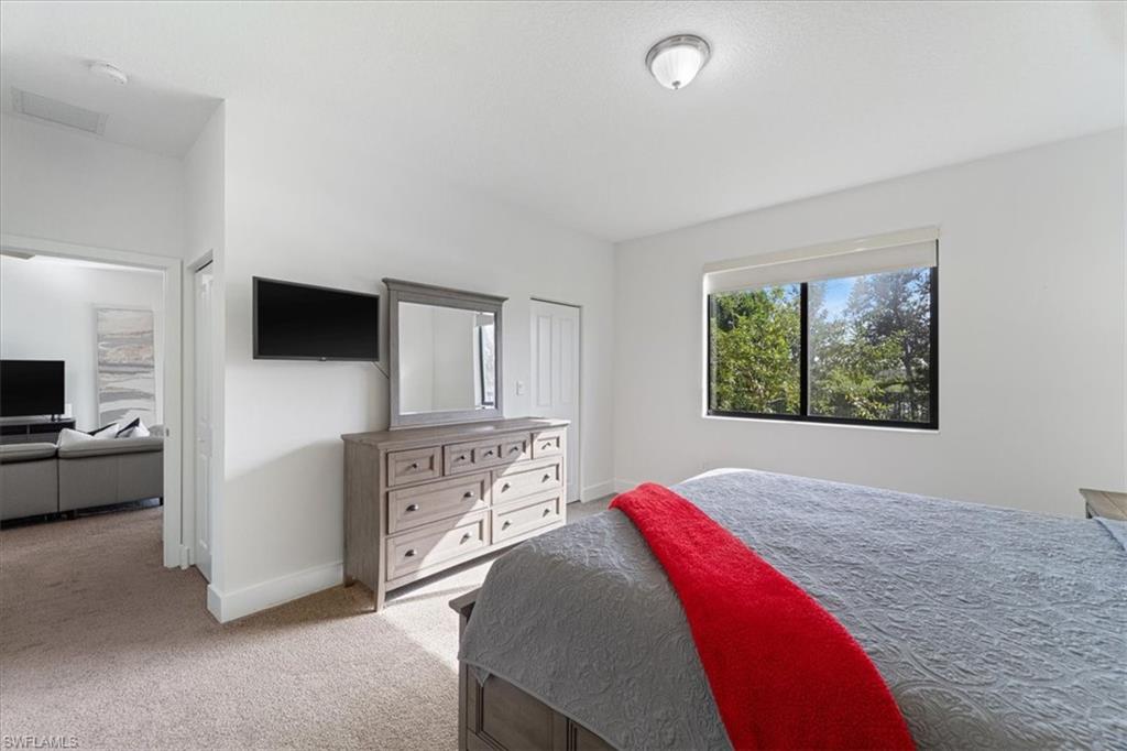 4925 Gambero Way Avenue Immokalee, FL 34142 - Photo 21 of 50 a bedroom with a bed and a television