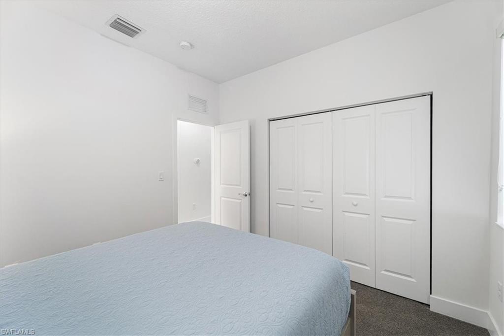 4925 Gambero Way Avenue Immokalee, FL 34142 - Photo 24 of 50 a bedroom with a bed and a shower