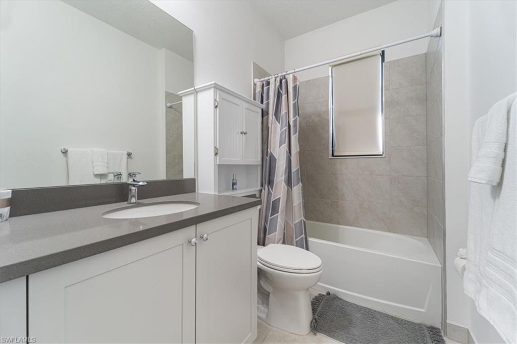 4925 Gambero Way Avenue Immokalee, FL 34142 - Photo 26 of 50 a bathroom with a granite countertop sink toilet and shower