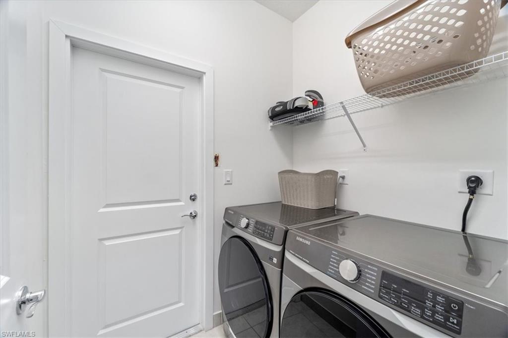 4925 Gambero Way Avenue Immokalee, FL 34142 - Photo 28 of 50 a view of storage and utility room with washer and dryer
