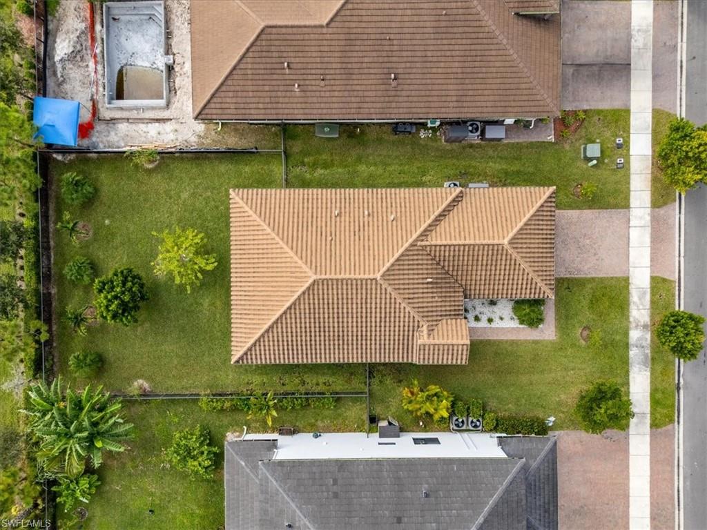 4925 Gambero Way Avenue Immokalee, FL 34142 - Photo 32 of 50 an aerial view of a house with a garden and swimming pool