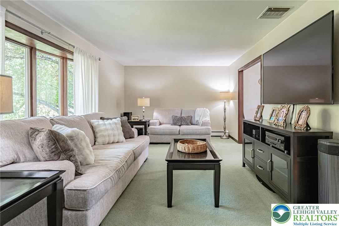 3857 Friedens Road Slatington, PA 18080 - Photo 33 of 75 This bright living space offers comfort and expansive views through large windows.