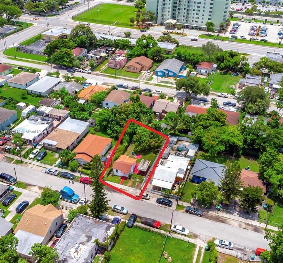 2356 Northwest 55th Terrace Miami, FL 33142 - Photo 1 of 3 an aerial view of residential houses with outdoor space and street view