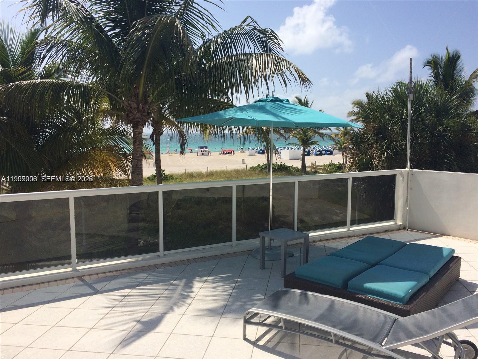 100 Lincoln Road, Unit 903 Miami Beach, FL 33139 - Photo 11 of 17 a backyard of a house with barbeque oven table and chairs