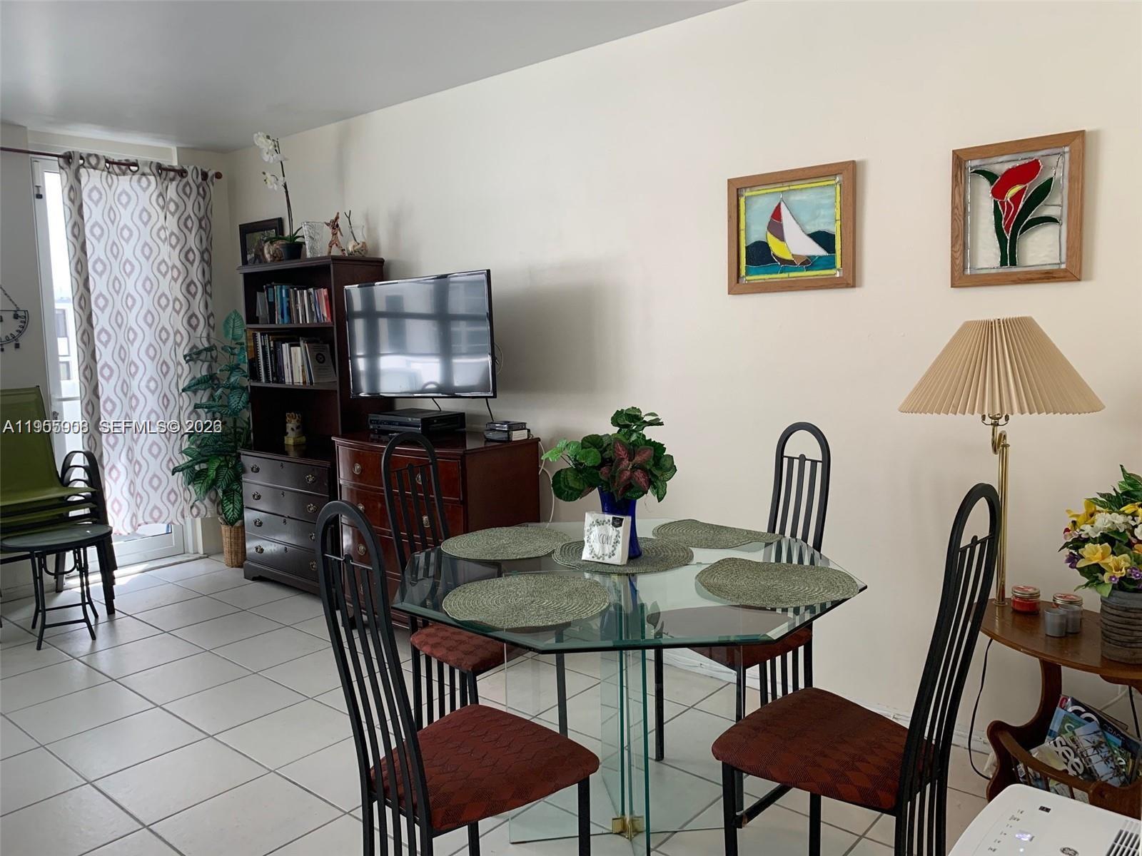 100 Lincoln Road, Unit 903 Miami Beach, FL 33139 - Photo 7 of 17 a view of a dining room with furniture