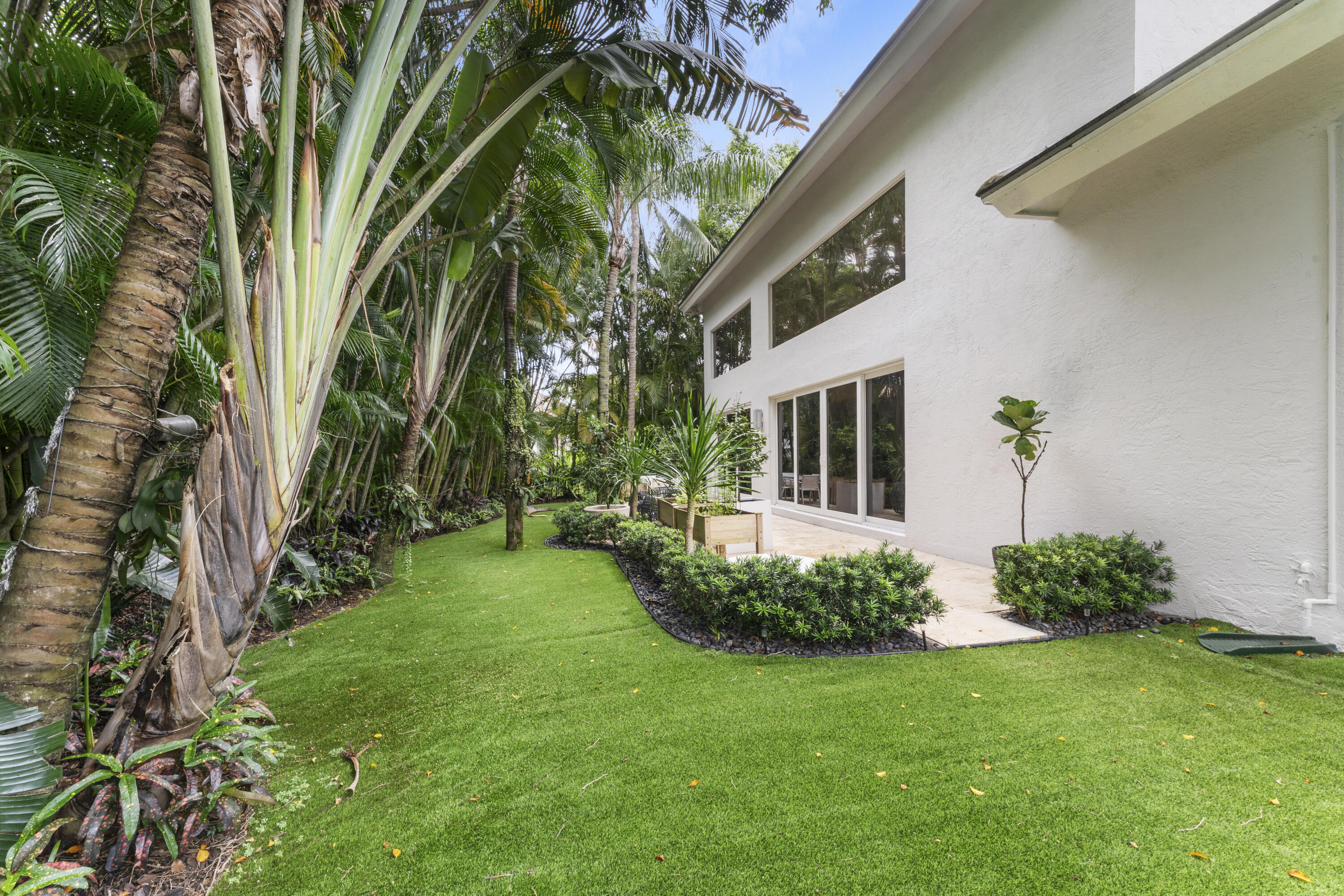 3156 Northwest 61st Street Boca Raton, FL 33496 - Photo 39 of 46 a view of an house with backyard and garden