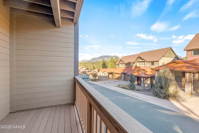 a view of balcony with furniture