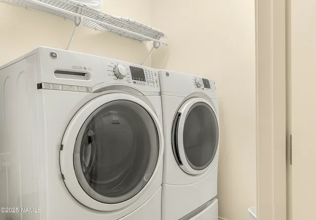 a utility room with dryer and washer