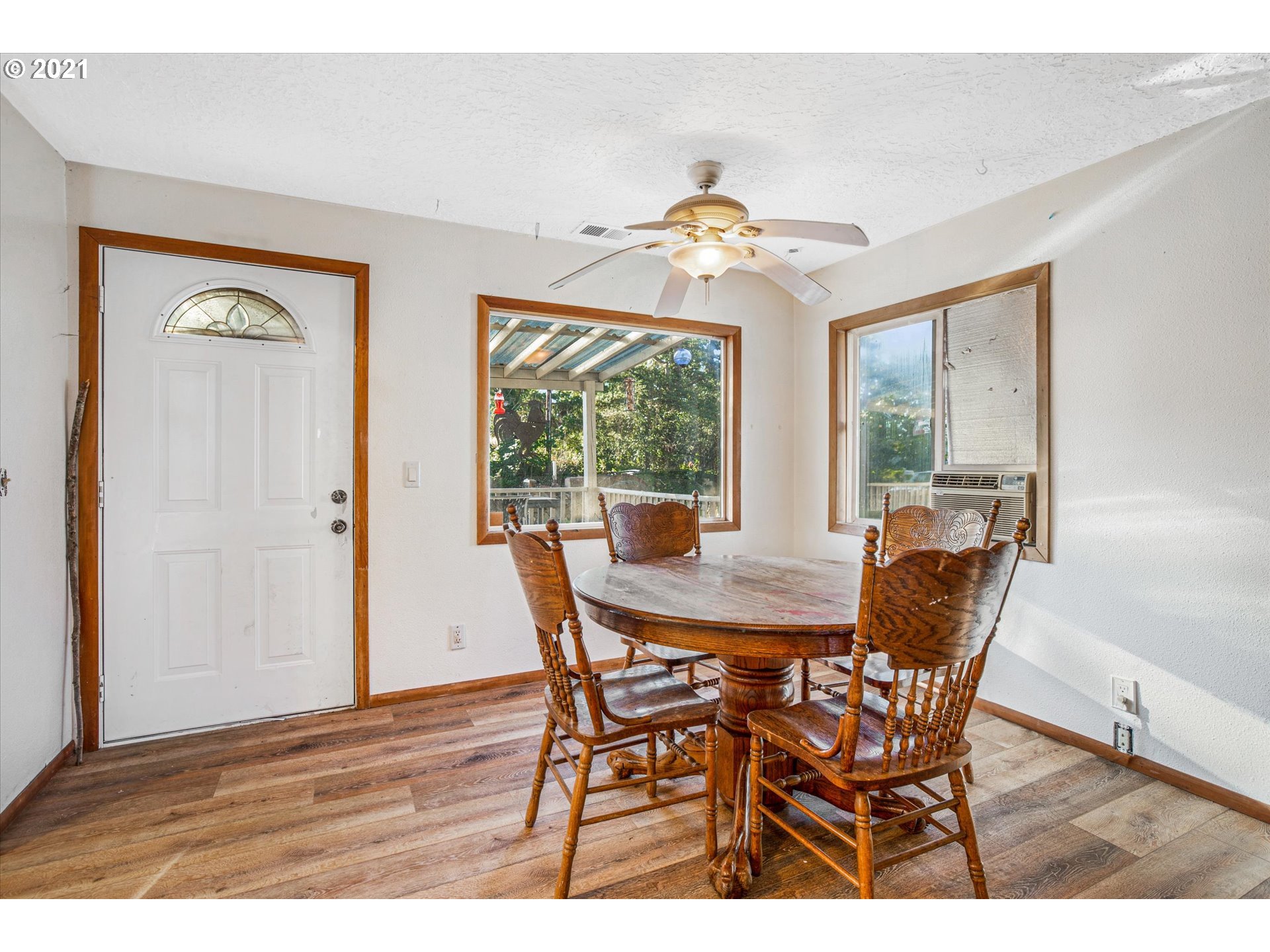 17707 Southeast Amisigger Road Boring, OR 97009 - Photo 4 of 23 a view of a dining room with furniture window and outside view