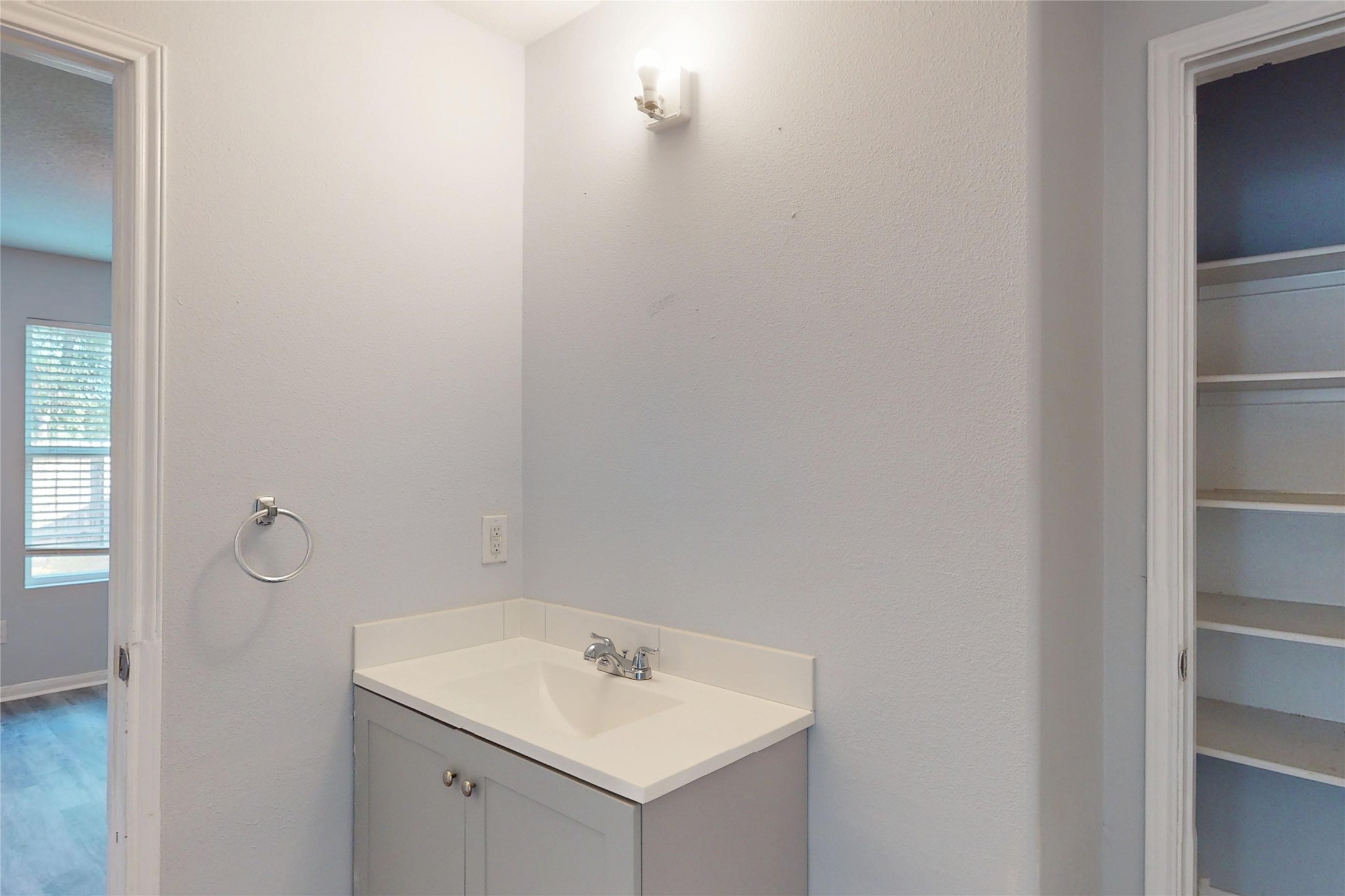 9877 Lace Flower Way Conroe, TX 77385 - Photo 38 of 43 a bathroom with a sink and a mirror