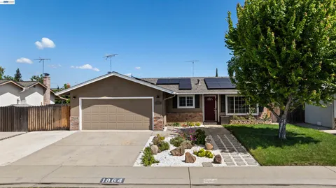 a front view of a house with yard