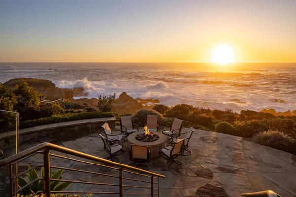 a view of a chairs and table on the terrace