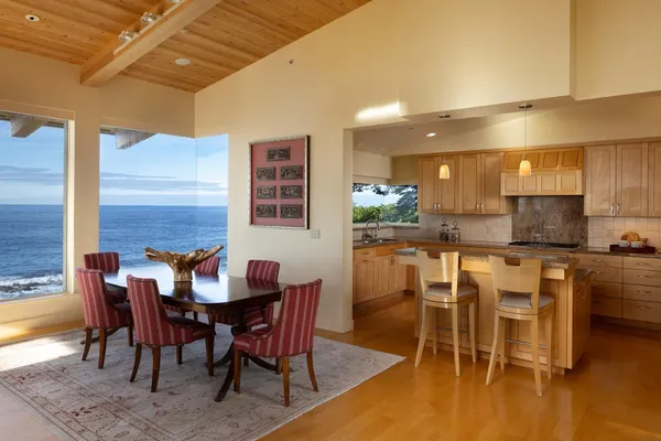 a kitchen with granite countertop cabinets and steel stainless steel appliances