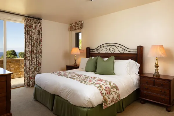 a bedroom with a bed and a television in it