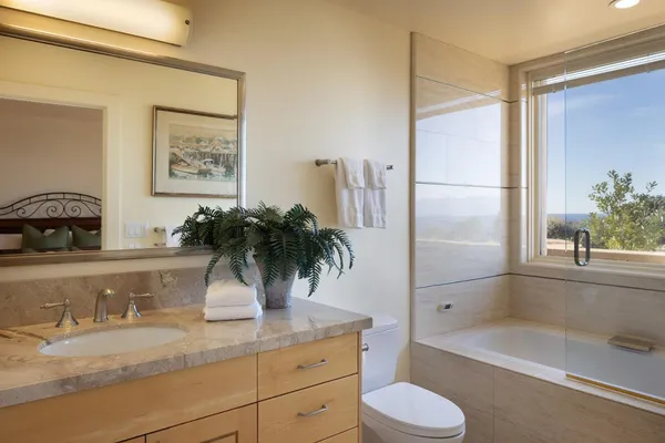 a bathroom with a bathtub and shower