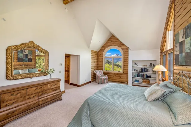 a bathroom with a double vanity sink toilet and a mirror