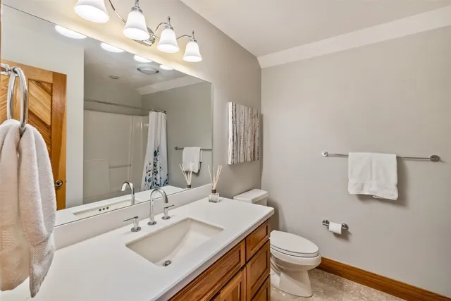 a living room with pool table and furniture
