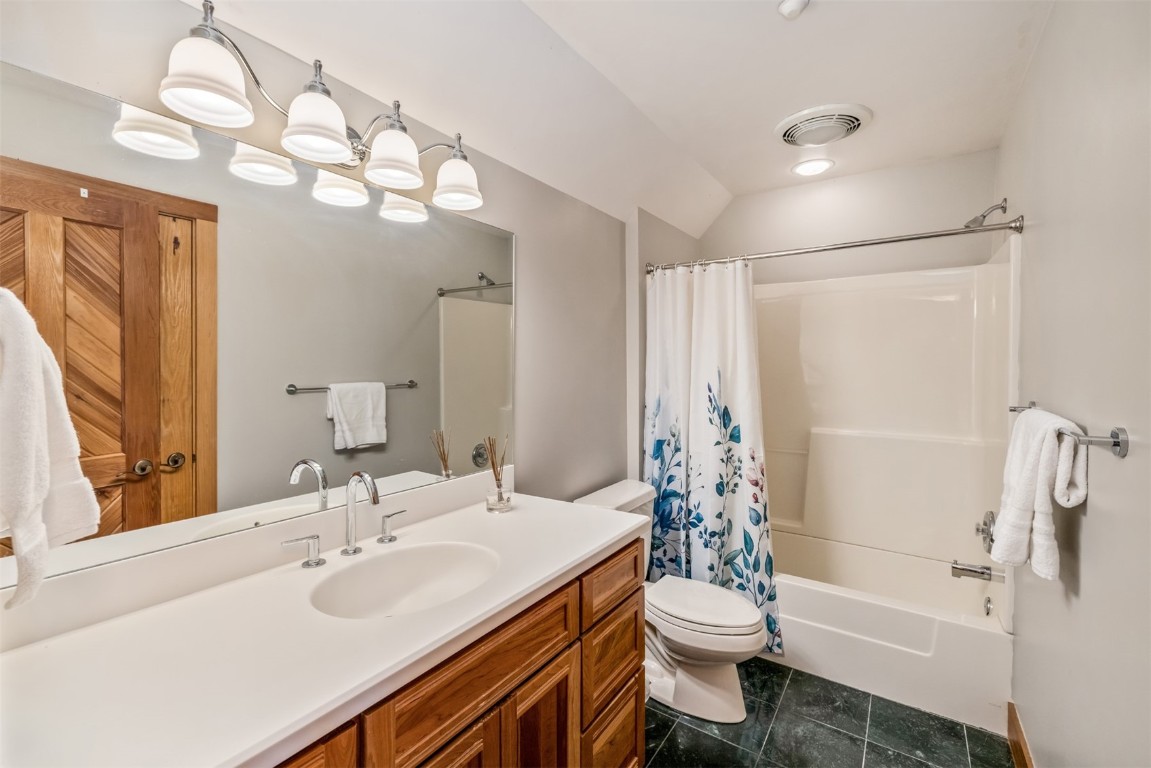 2244 Johnson Road Silverthorne, CO 80498 - Photo 29 of 45 a bathroom with a double vanity sink toilet and a mirror