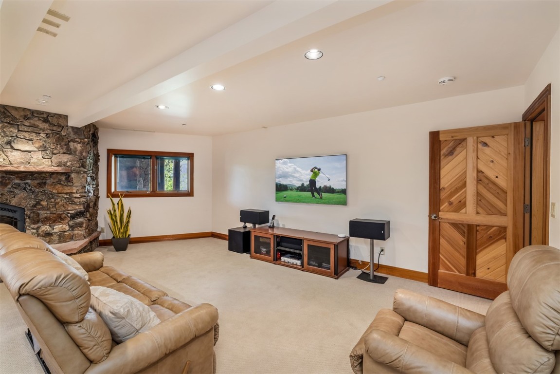 2244 Johnson Road Silverthorne, CO 80498 - Photo 31 of 45 a living room with furniture and a flat screen tv