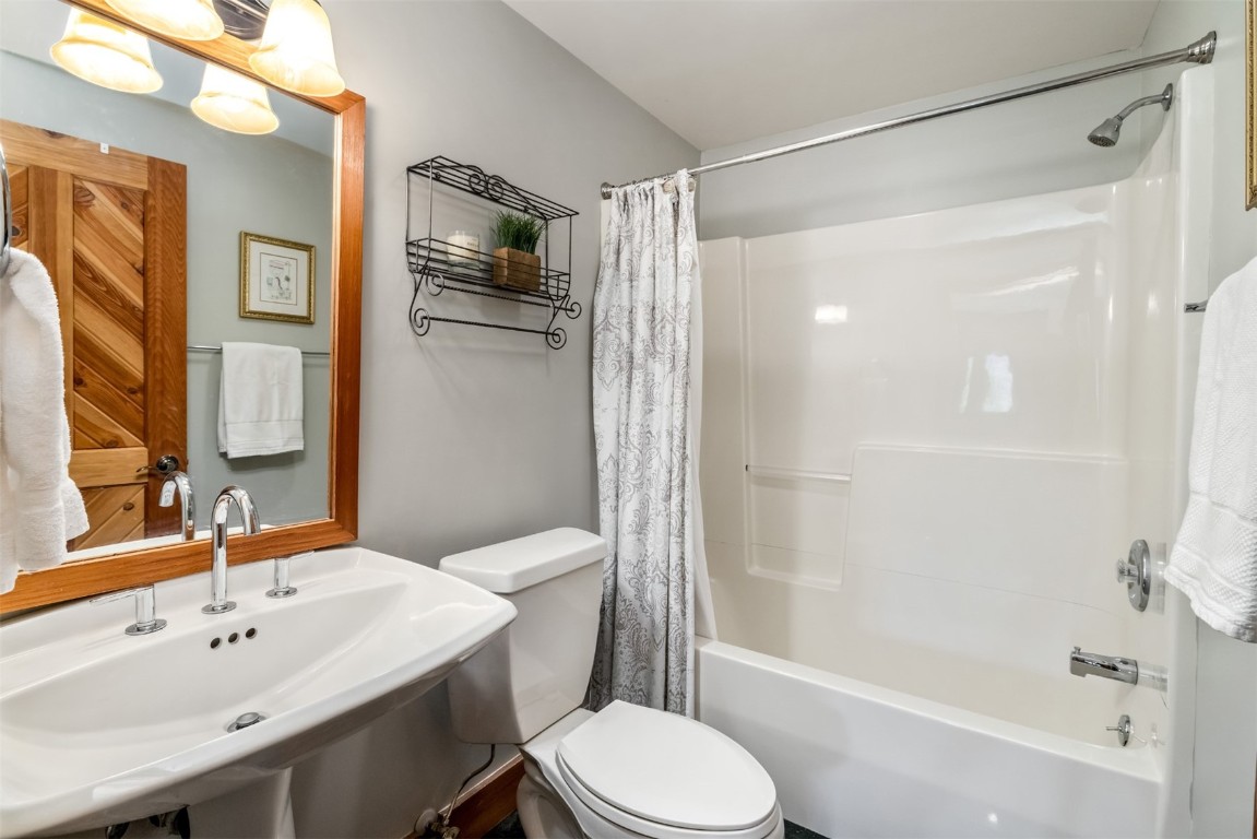 2244 Johnson Road Silverthorne, CO 80498 - Photo 34 of 45 a bathroom with a sink toilet and shower
