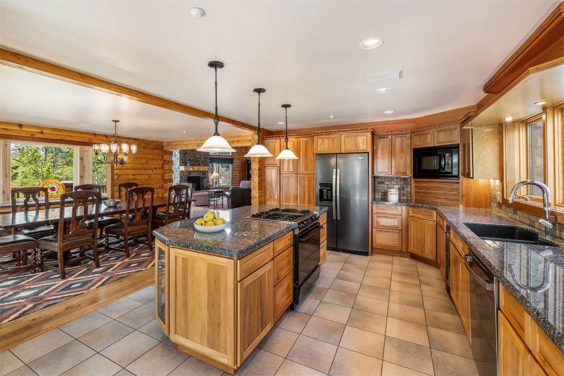 2244 Johnson Road Silverthorne, CO 80498 - Photo 8 of 45 a kitchen with stainless steel appliances granite countertop a stove oven and a refrigerator