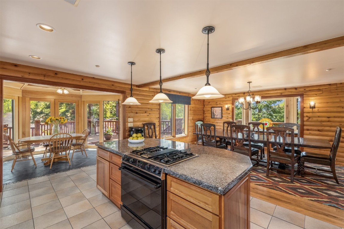 2244 Johnson Road Silverthorne, CO 80498 - Photo 10 of 45 a kitchen with a stove a sink a counter top space and living room view