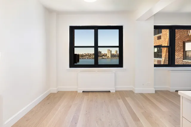 a kitchen with stainless steel appliances a stove a sink and a microwave