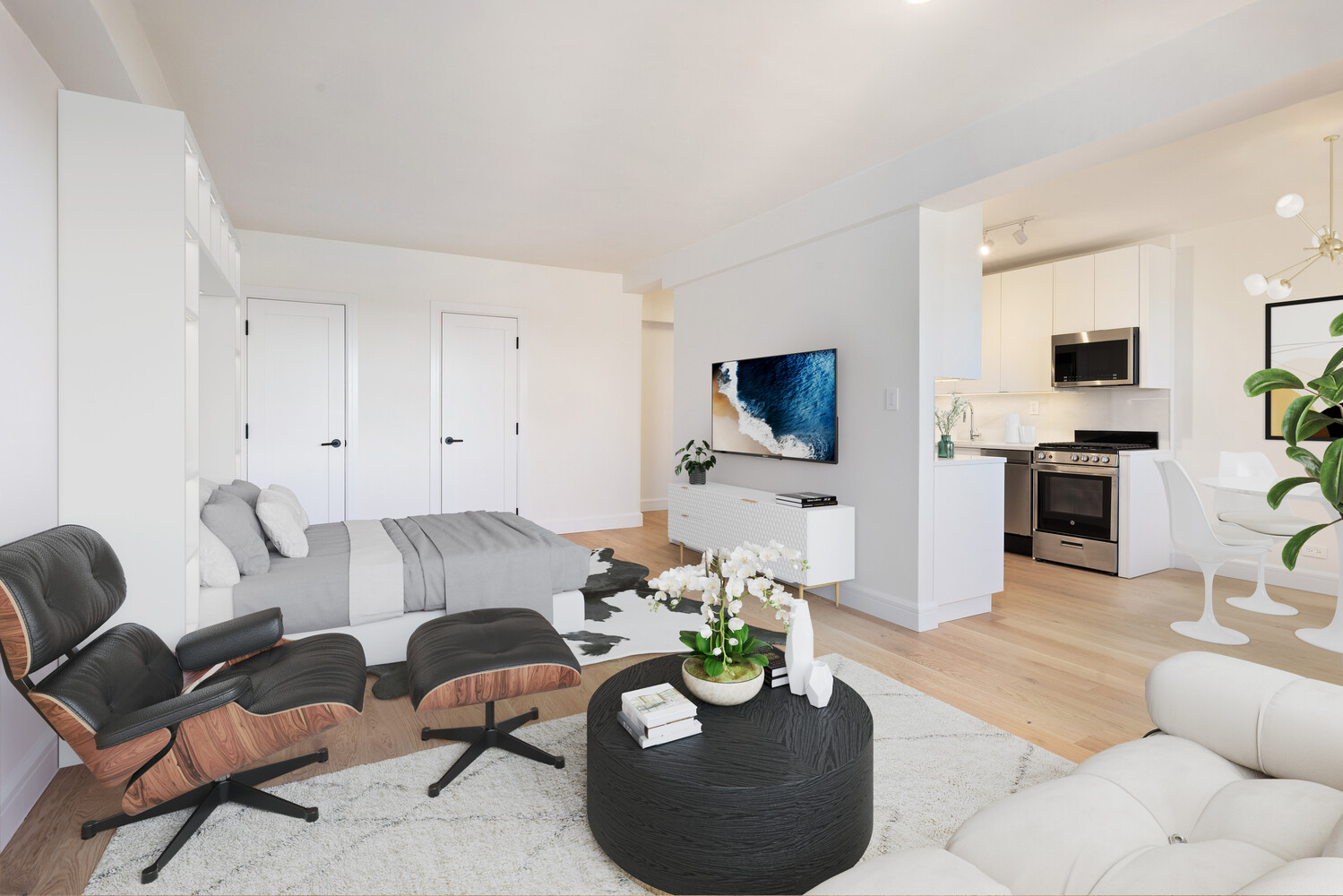 11 Riverside Drive, Unit 15HW Manhattan, NY 10023 - Photo 3 of 14 a living room with furniture a flat screen tv and kitchen view