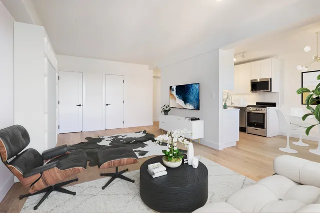 a bedroom with a bed and flat screen tv