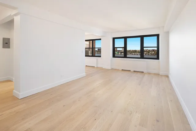 a bathroom with a shower a sink and a mirror