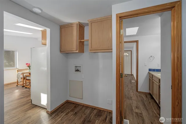 a view of hallway with wooden floor